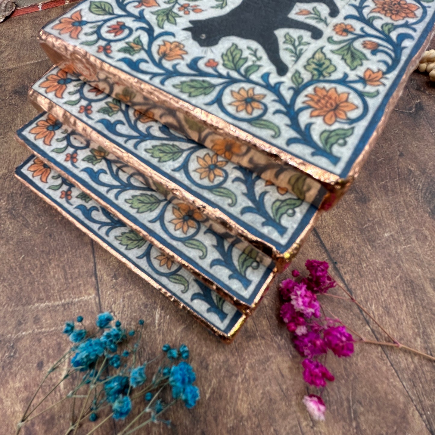 Set of four elegant black cat coasters with copper edging, William Morris