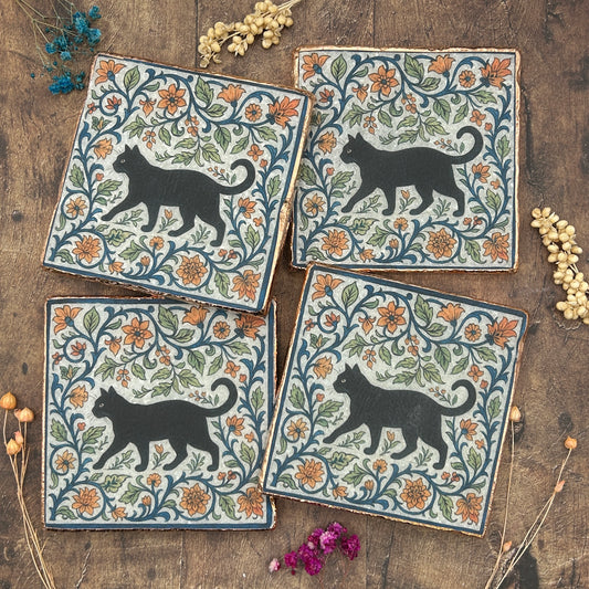 Set of four elegant black cat coasters with copper edging, William Morris￼